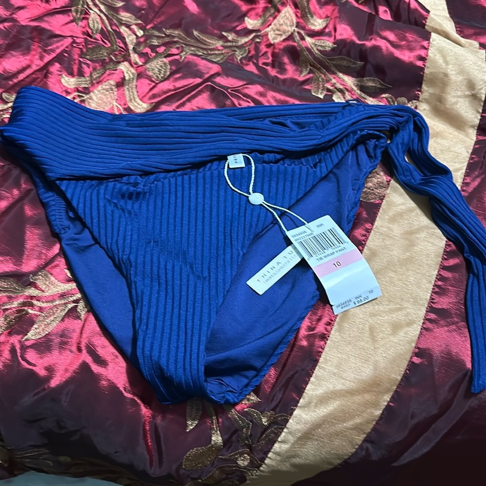 Trina Turk swim bottoms size 10 new with tags blue has a tie wrap